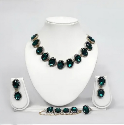 Emerald green crystal jewelry set in silver-tone with necklace, earrings, bracelet, and ring