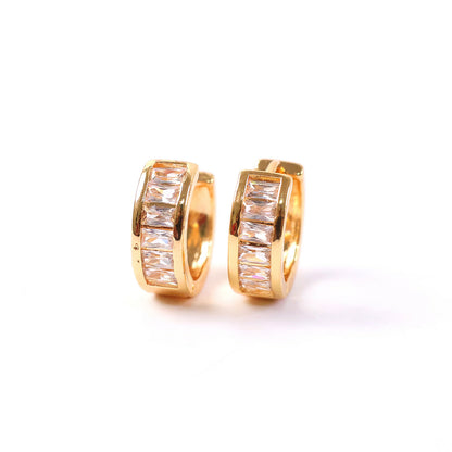 Gold hoop earrings with sparkling CZ stones adding refined shine and style