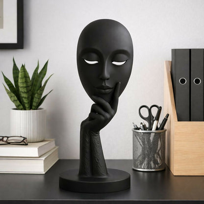 Side view of modern abstract face decorative statue