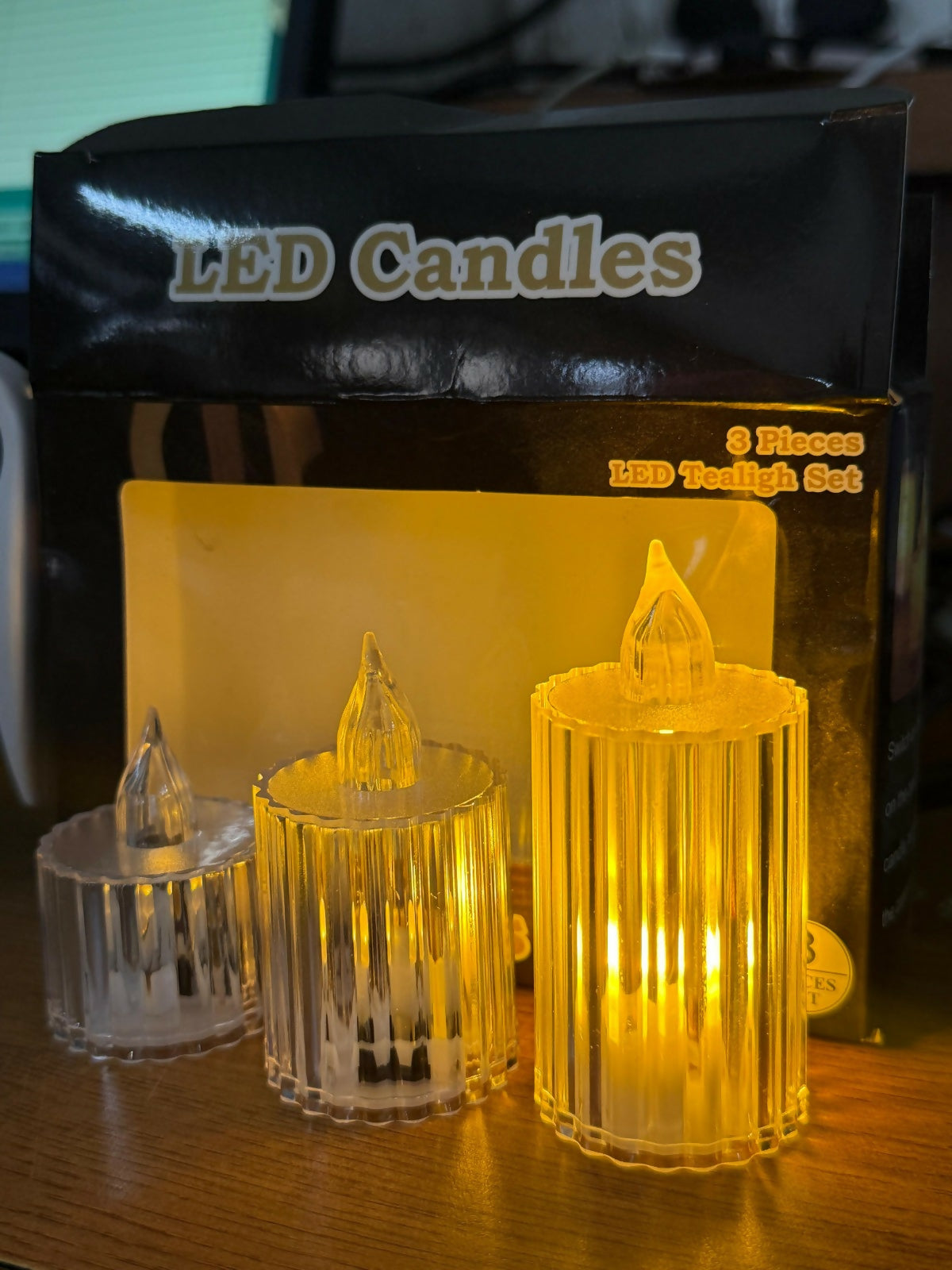 Three crystal-look LED candles in front of their product packaging, showing the 'LED Candles' label.