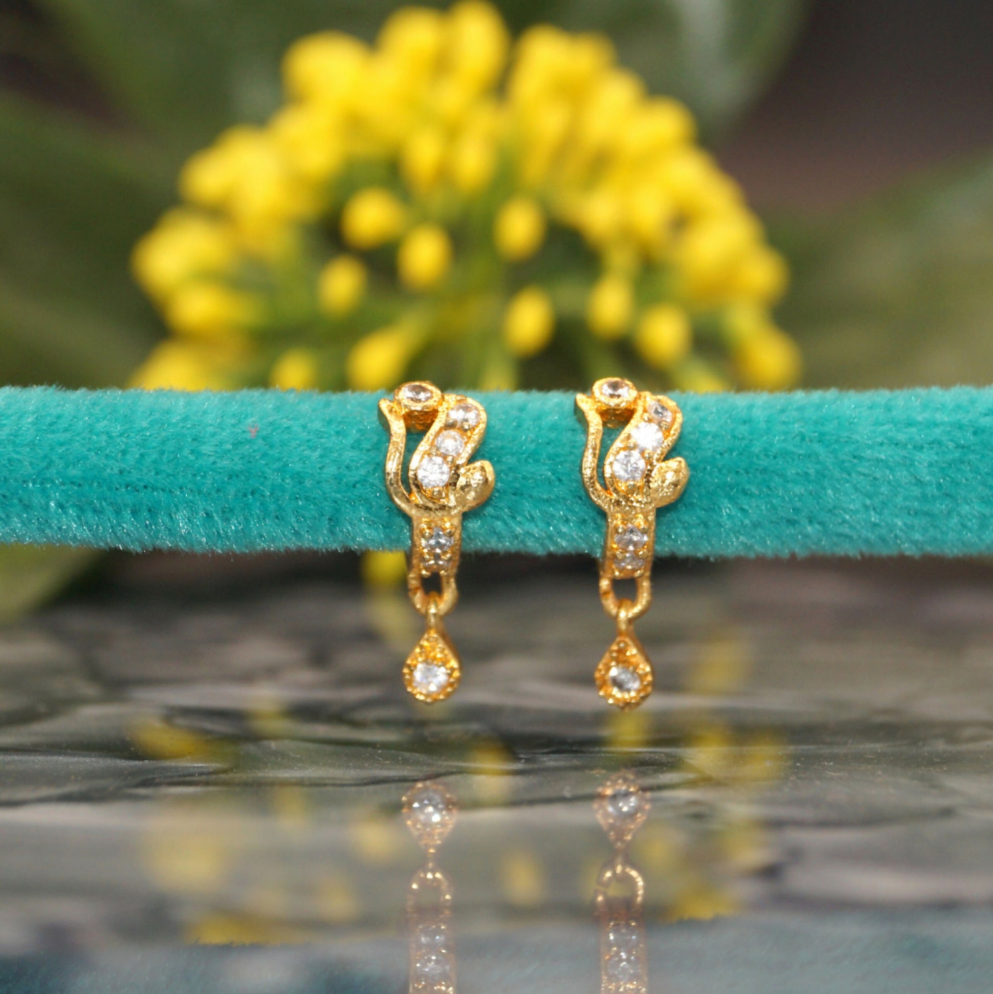 Bali style gold plated CZ huggie hoop earrings with bezel-set stones