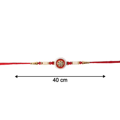 Festive red Rakhi with intricate centerpiece