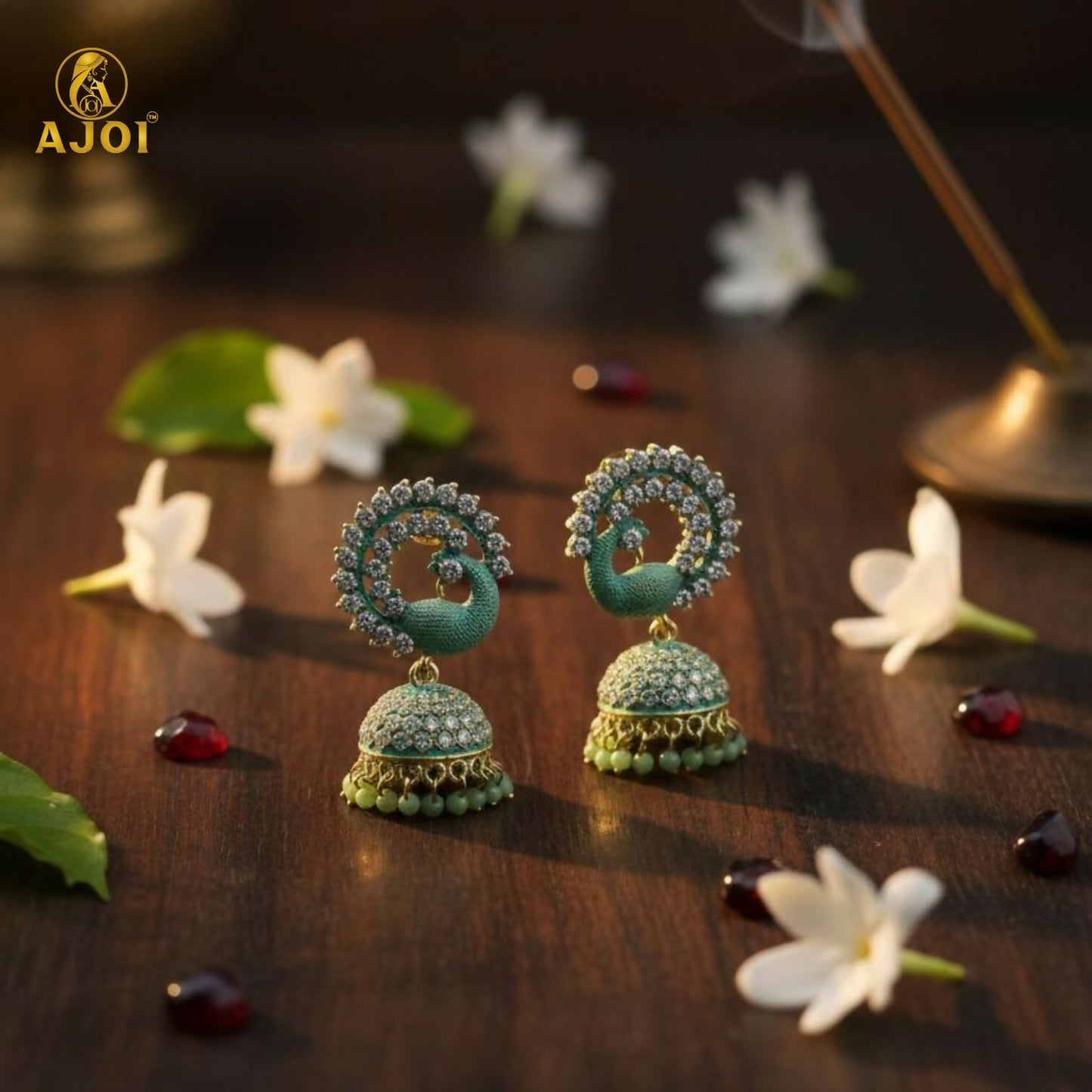 Pair of mint green peacock stone jhumka earrings