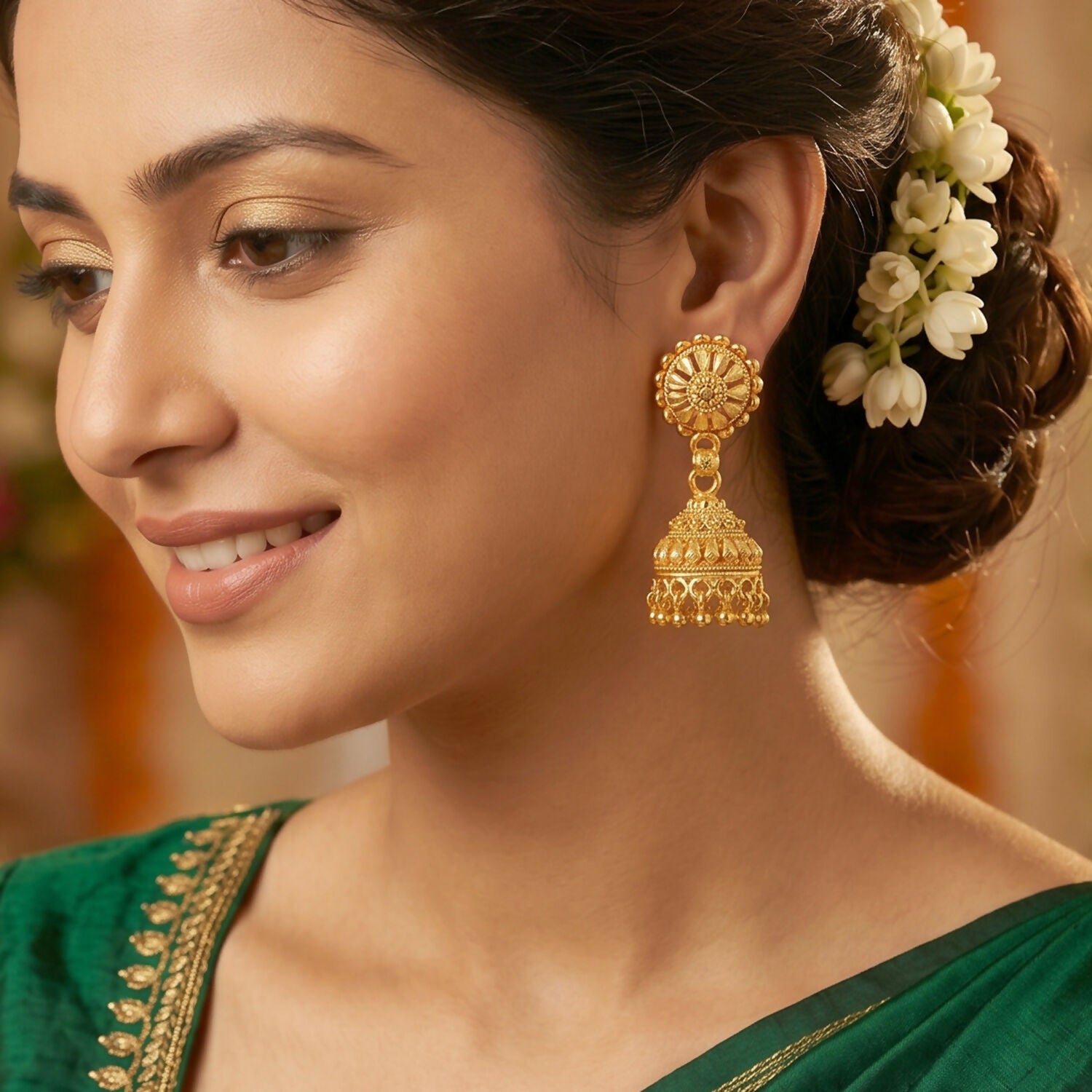 Traditional gold jhumka earrings with pearl embellishments