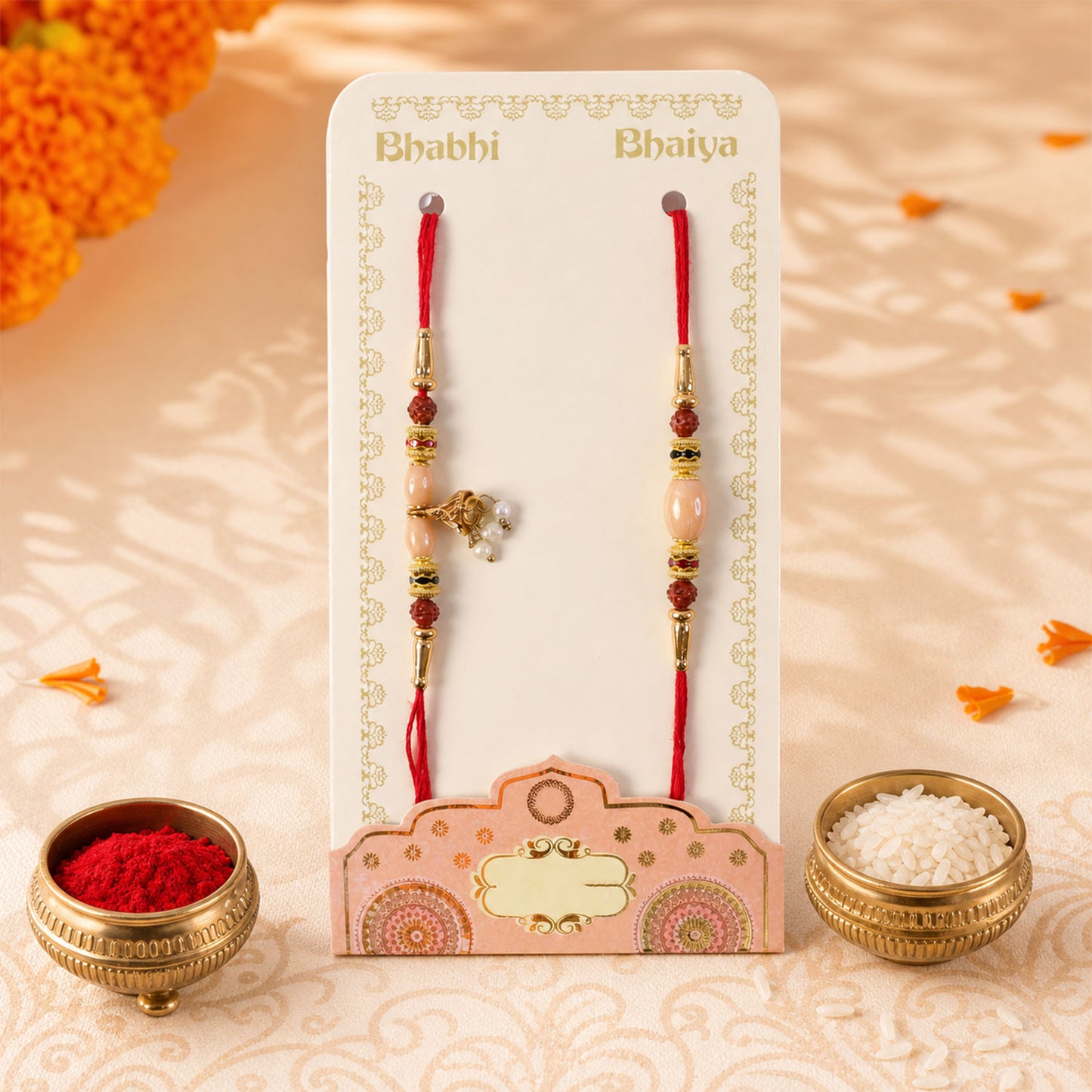 Couple Rakhi with Peach Oval Center Bead and Pearl Drop Charm