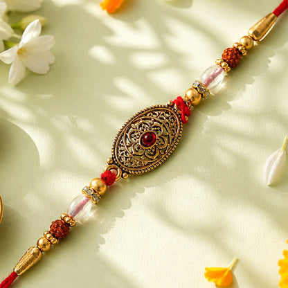 Oxidized Gold Oval Pendant Rakhi with Red Stone and Rudraksha Beads