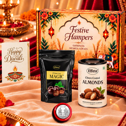 A festive hamper box with a black pouch of Choco Magic, a tin of Choco Coated Almonds, a silver coin, and a greeting card on