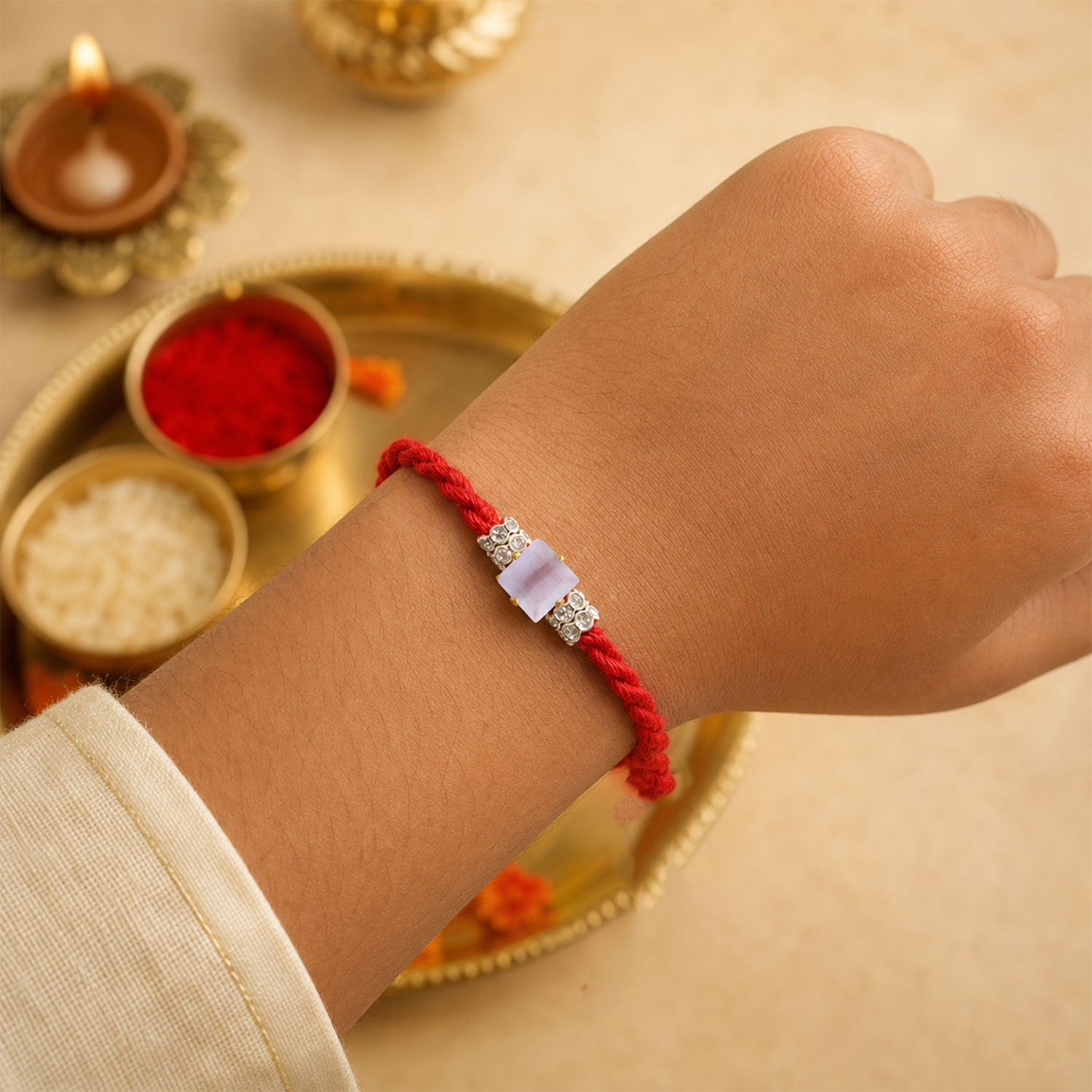 Red Twisted Cord Rakhi with a Bold Square Crystal Stone Pendant