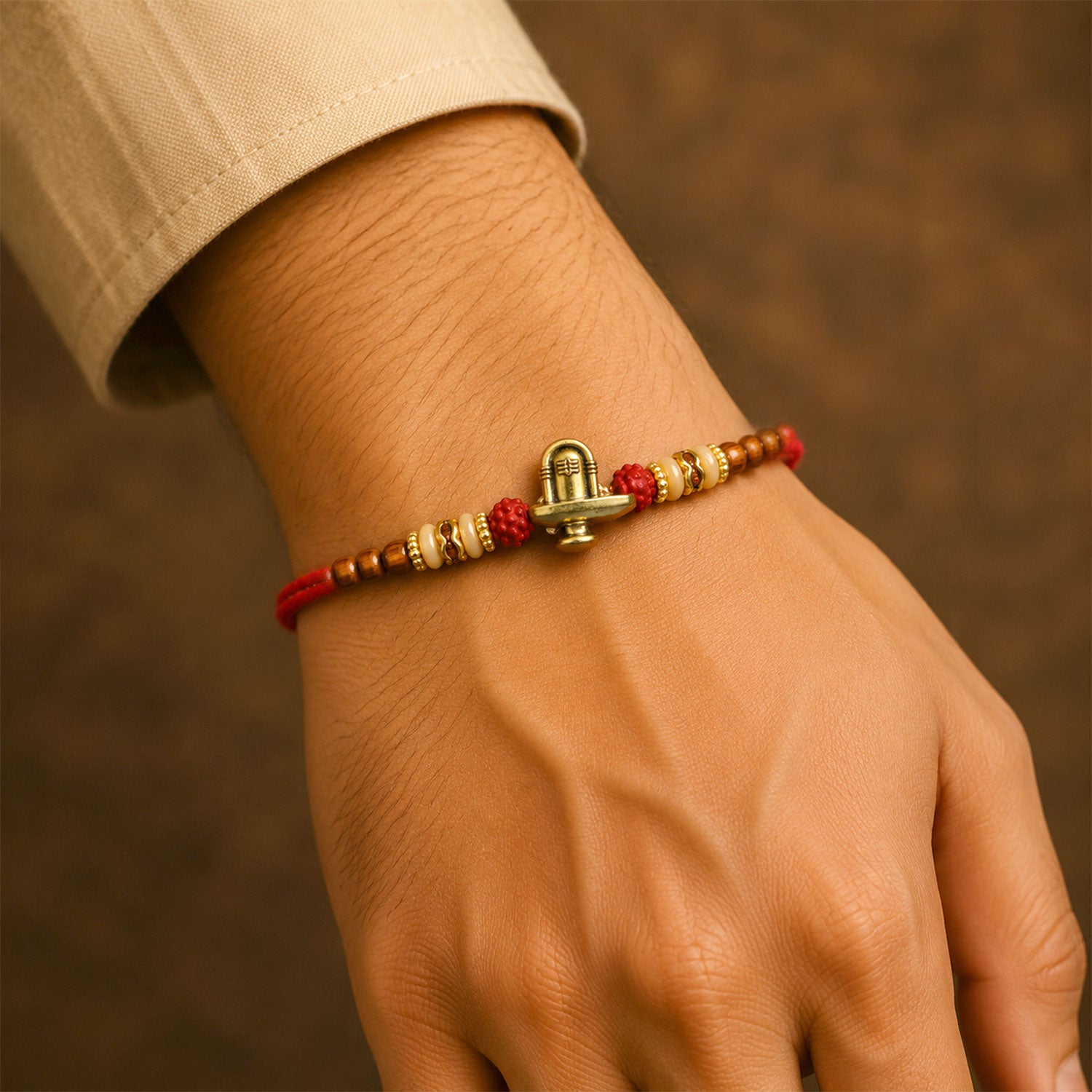 Lord Shiva Shivling Trishul Devotional Rakhi with Golden Temple Centre and Red Thread