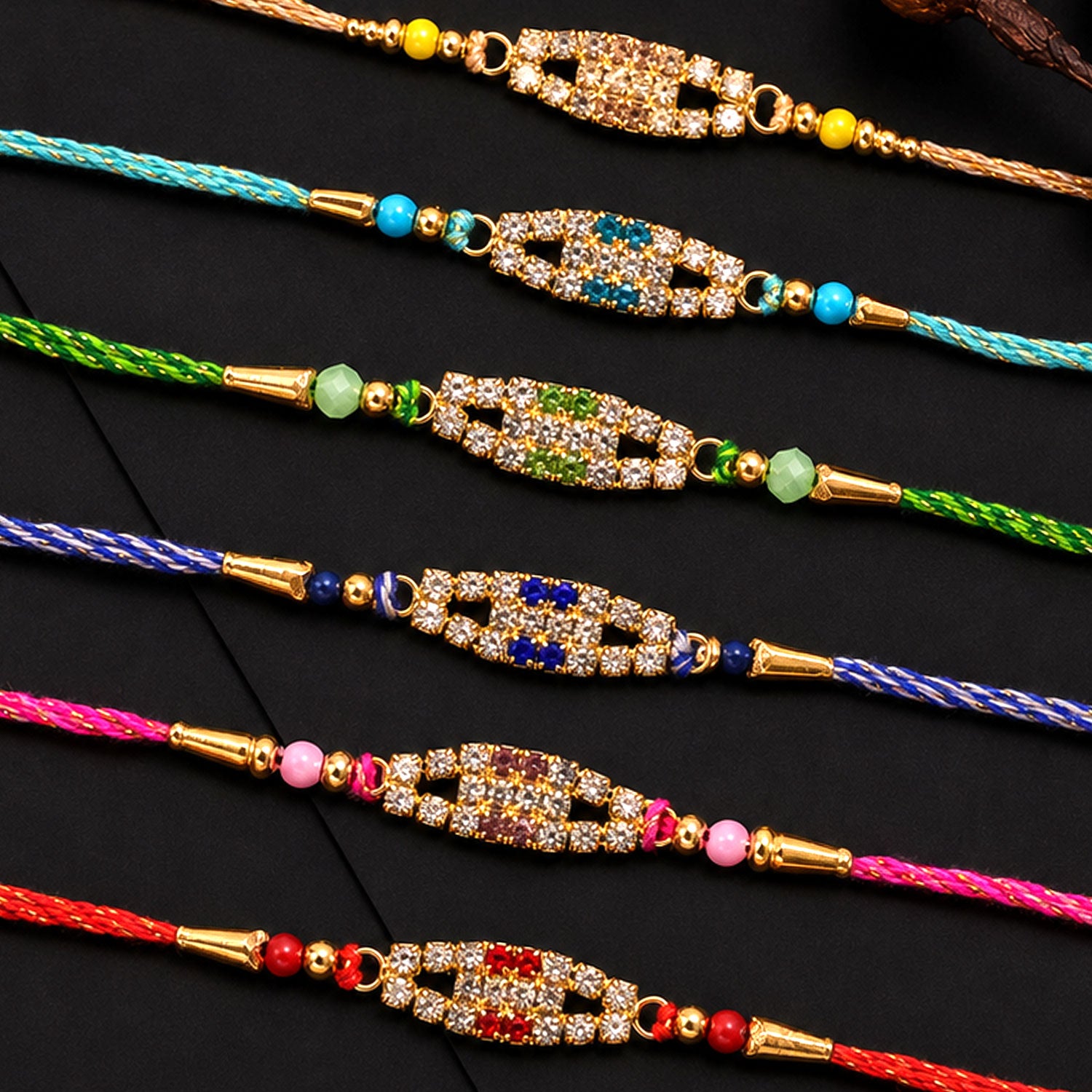Long Oval Centre Motif Rakhi in Mix Colour Threads (Pack of 6)