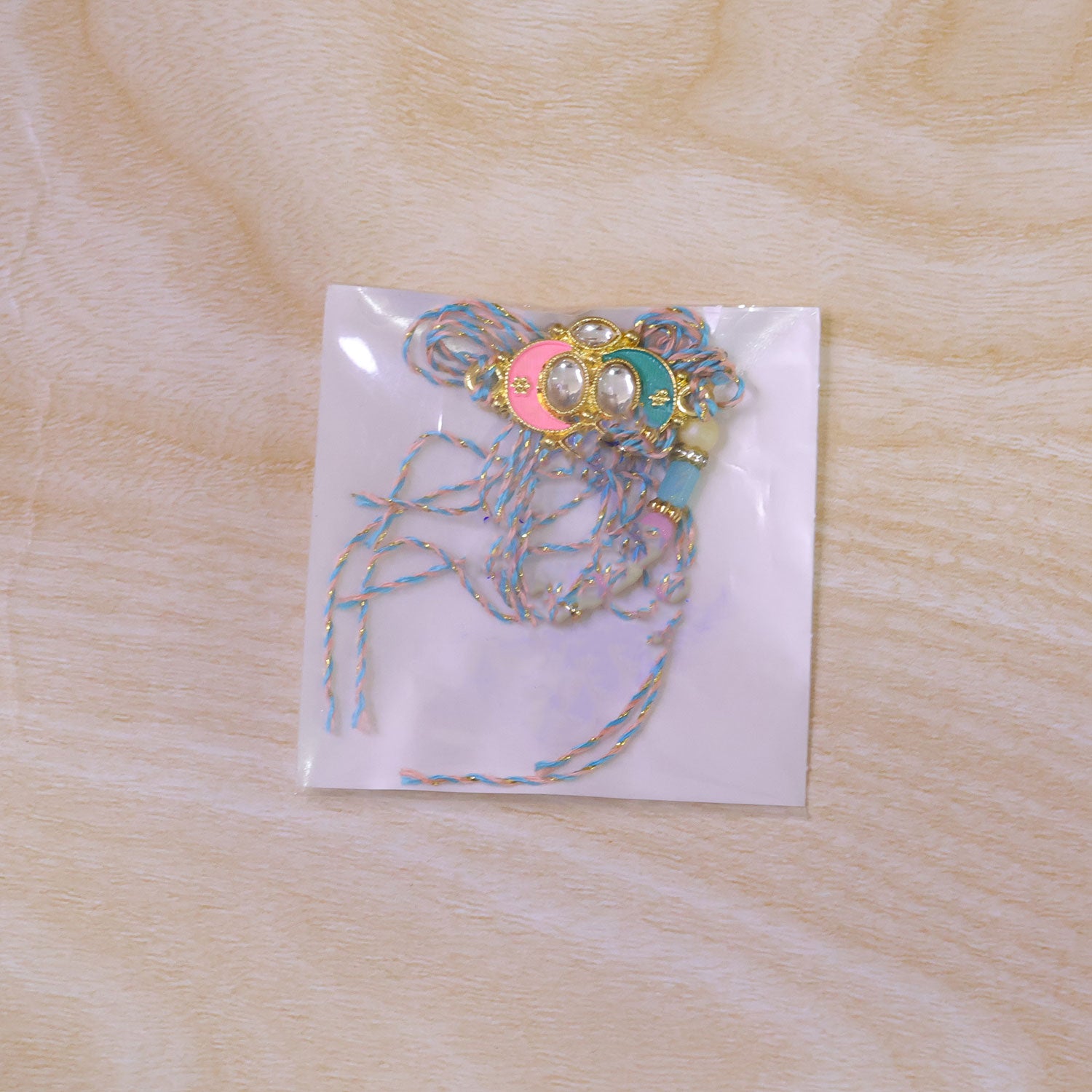 Teal and Pink Enamel Kundan Pendant Rakhi with Pastel Beads