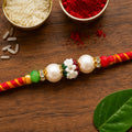 Golden Stone Rakhi – Colourful Beads & Festive Charm