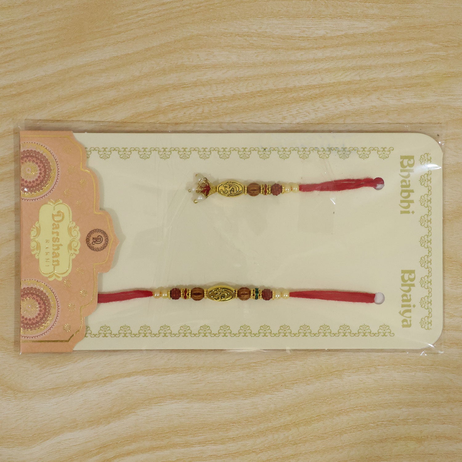 Antique Om Couple Rakhi Set with Rudraksha Style Beads and Pearl Lumba Charm Design