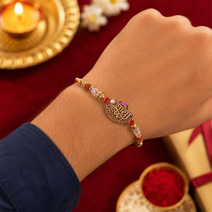 Radha Krishna Script Pendant Rakhi with Pink Kundan Beads