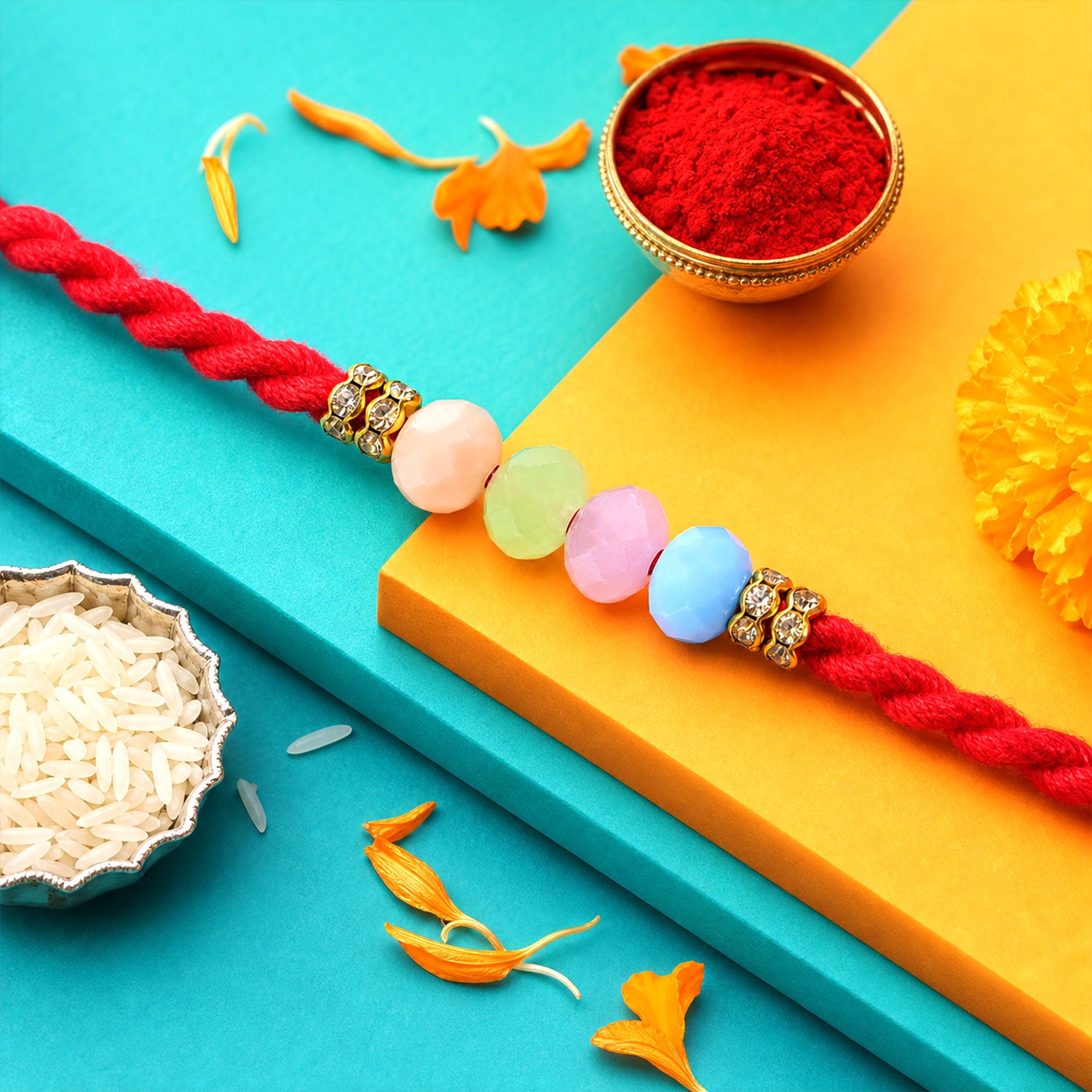 Red Twisted Cord Rakhi with Soft Pastel Multicolour Bead Accents