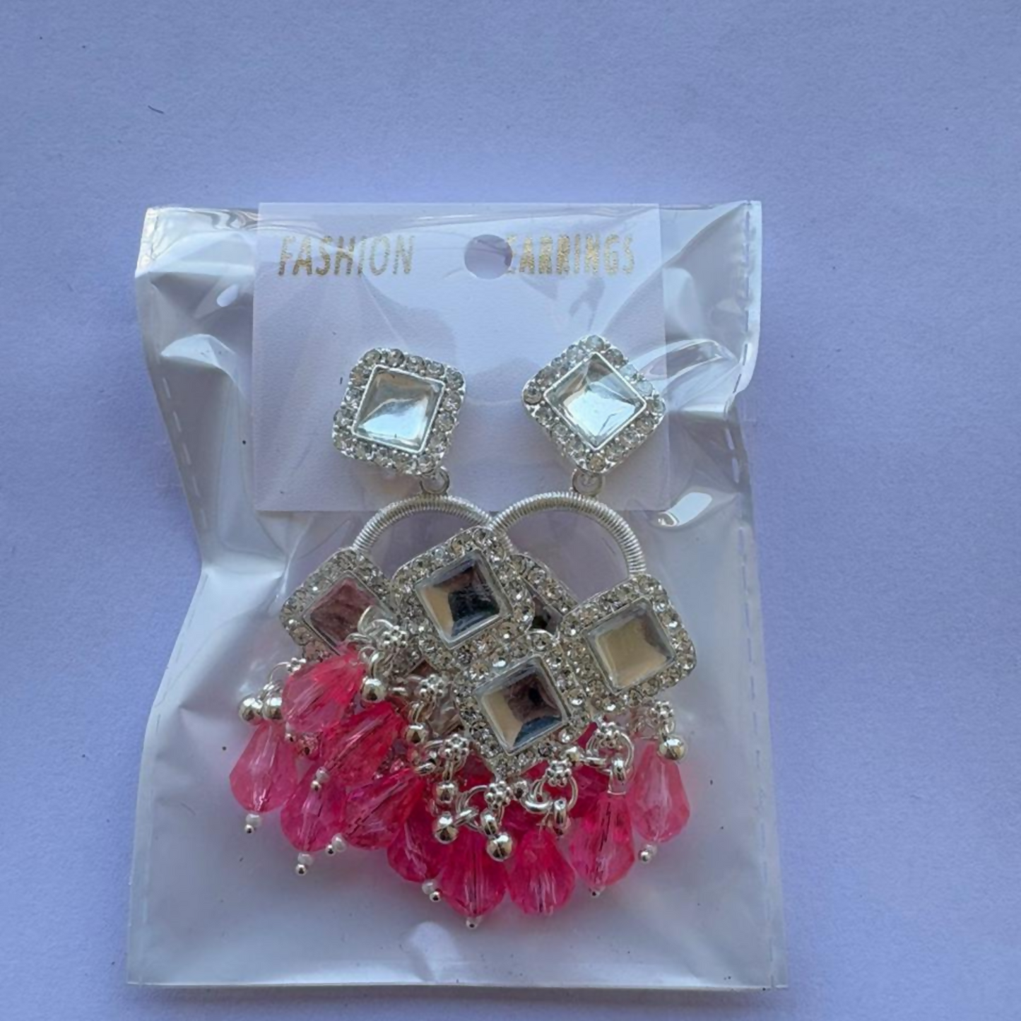 Pair of silver plated square crystal chandelier earrings on display stand