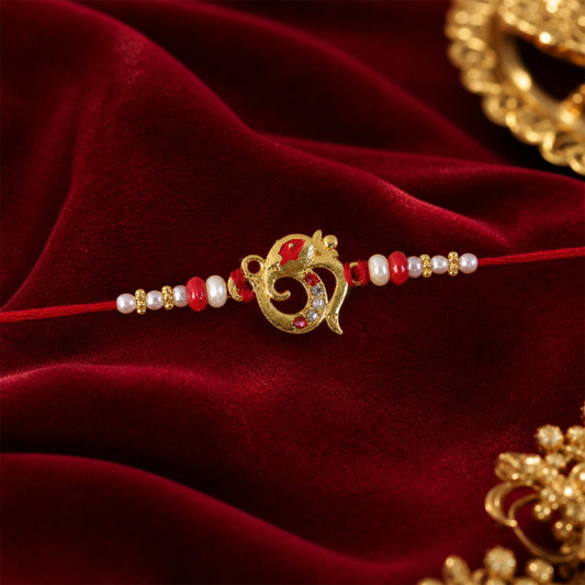 Golden Om Rakhi with Red Beads and Pearl Dotted Thread