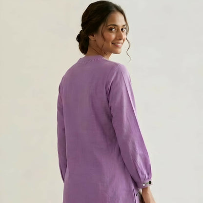 Back view of relaxed fit purple floral top with gathered cuffs