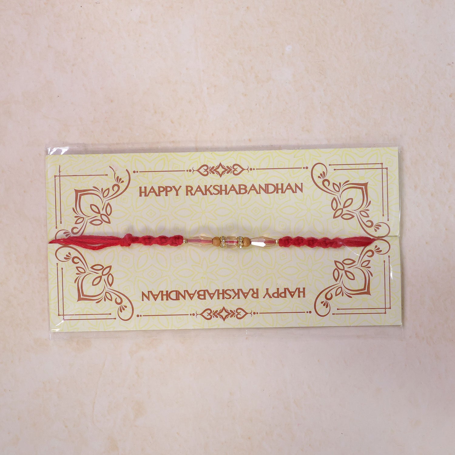 Red Thread Rakhi with Champagne Crystal Beads and Wooden Bead Accents