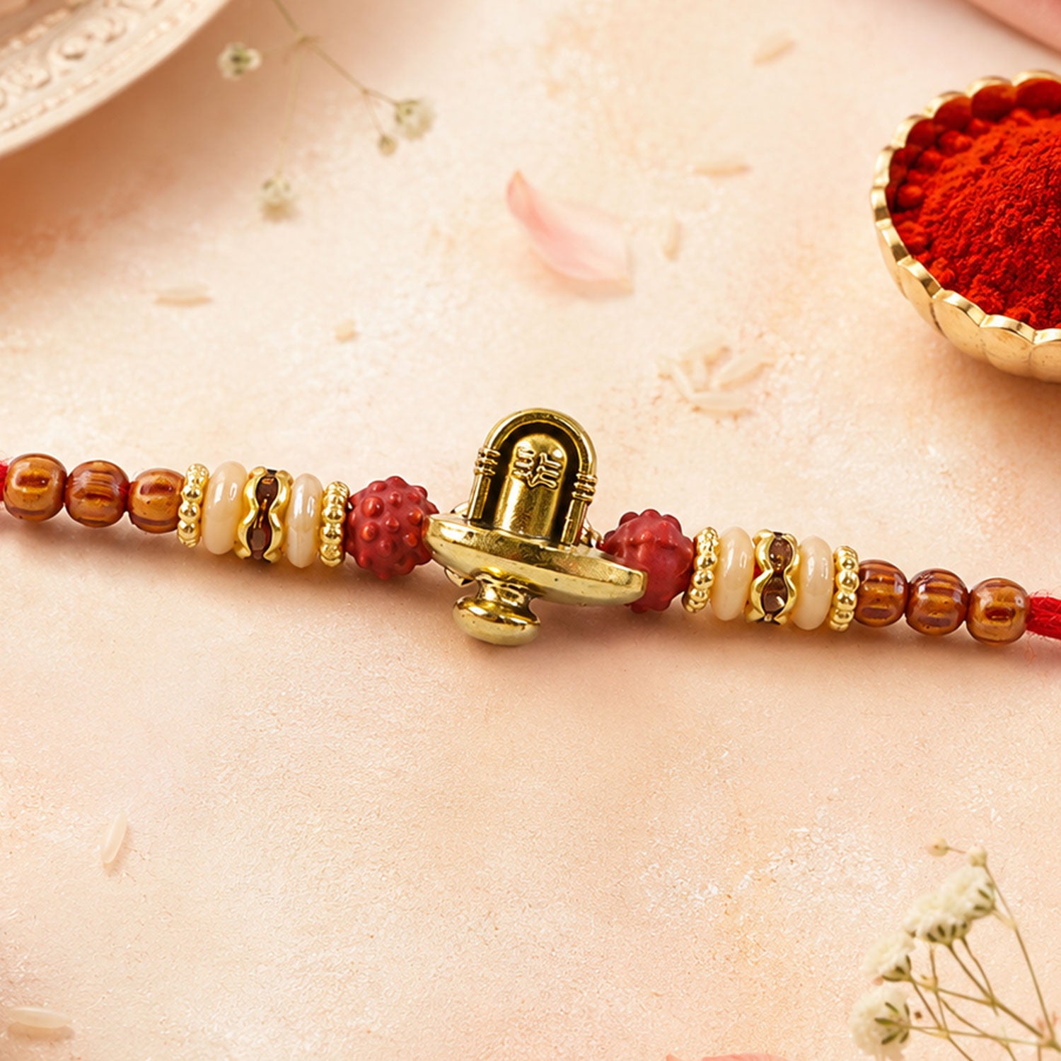 Lord Shiva Shivling Trishul Devotional Rakhi with Golden Temple Centre and Red Thread