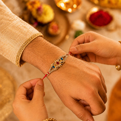 Red White Floral Rakhi with Triple Stone Center and Clean Finish