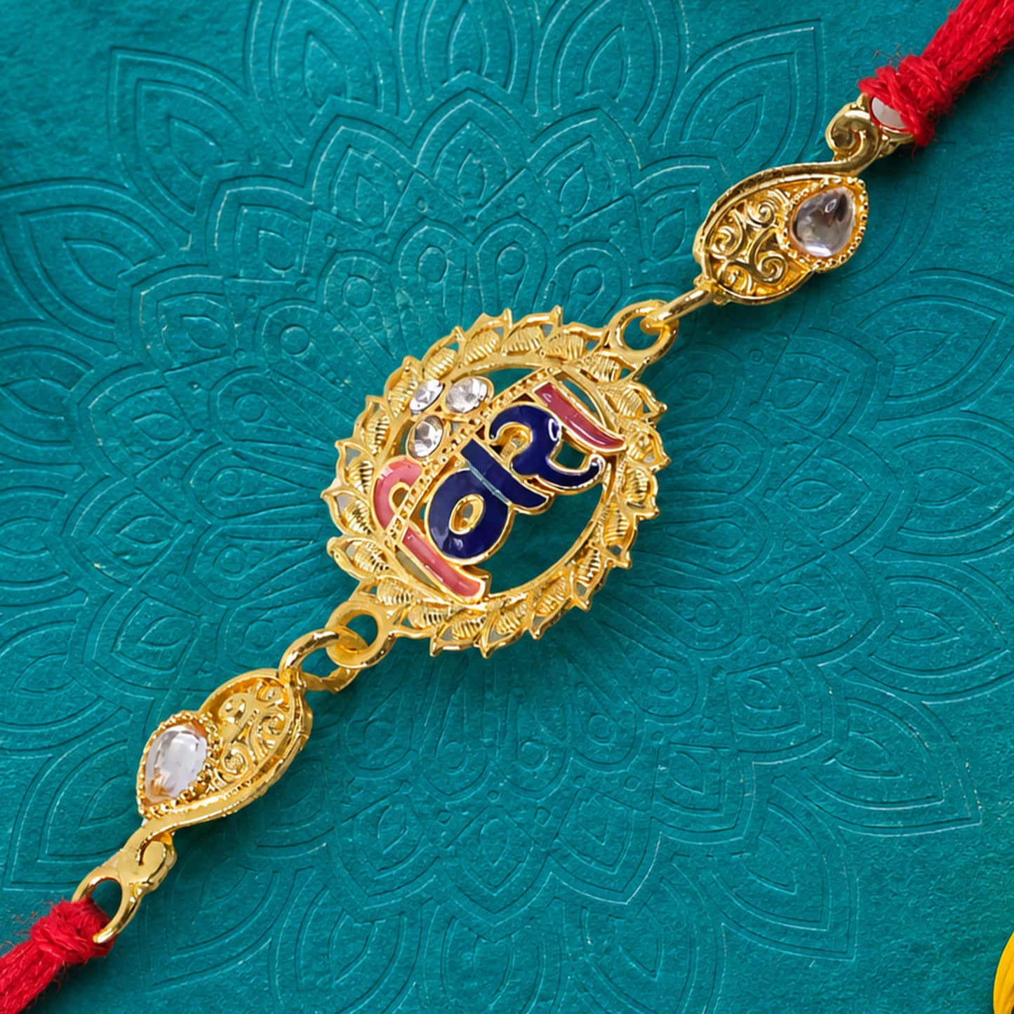 Antique Gold-Toned Vira Rakhi with Multicolor Enamel, Crystal Accents & Red Thread