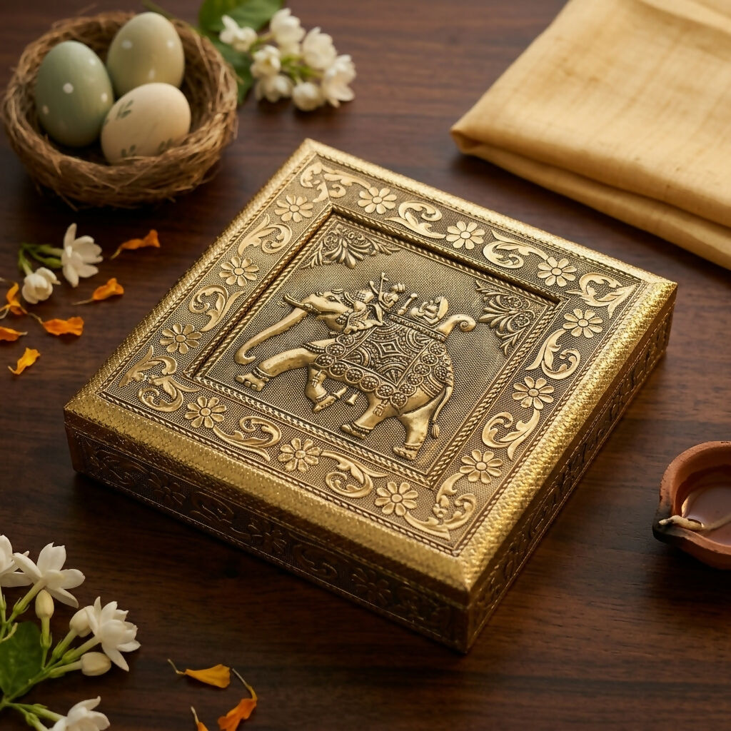 Open golden elephant Ambari metal jewelry box showing interior