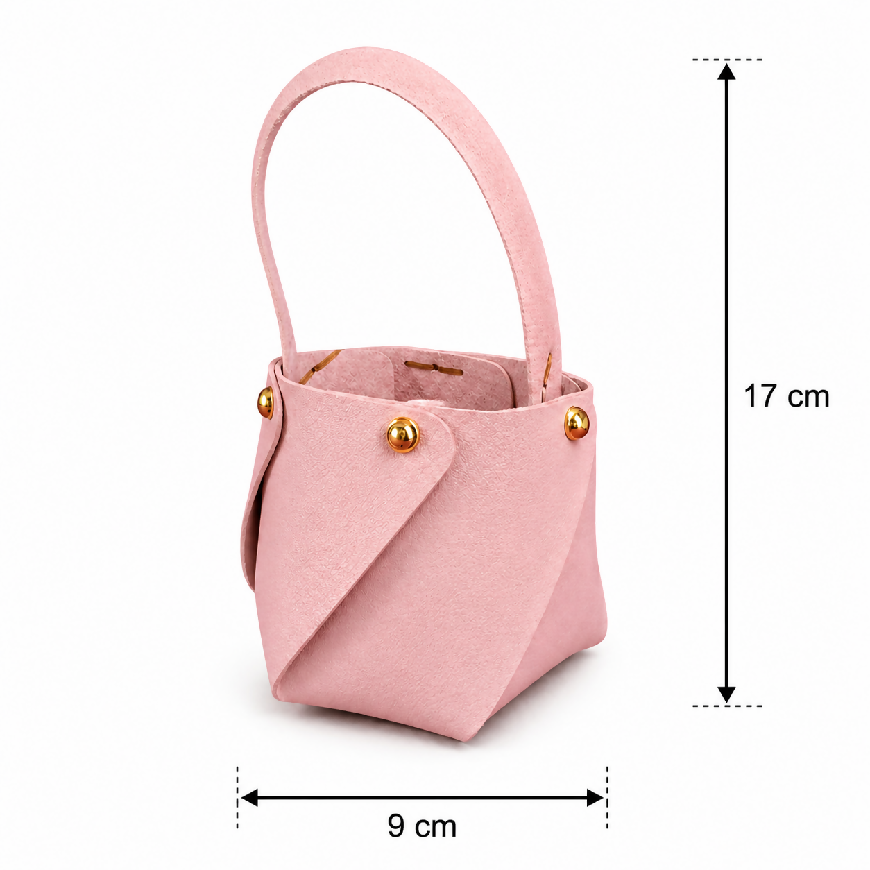 Pink mini bucket handbag in lifestyle setting