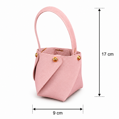 Pink mini bucket handbag in lifestyle setting