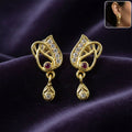 Traditional Gold Plated Teardrop Dangler Earrings With AD Stone And Ruby Detail