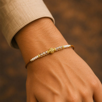 Minimal Pearl Golden Bracelet Rakhi with Sleek Beads and Elegant Red Thread