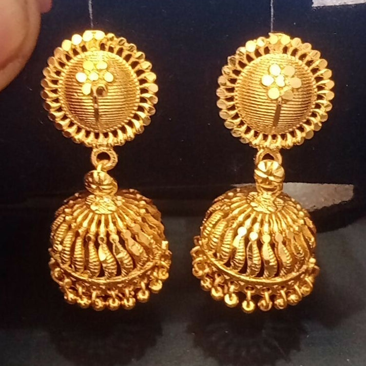 Traditional ethnic gold plated jhumka earrings styled with festive wear
