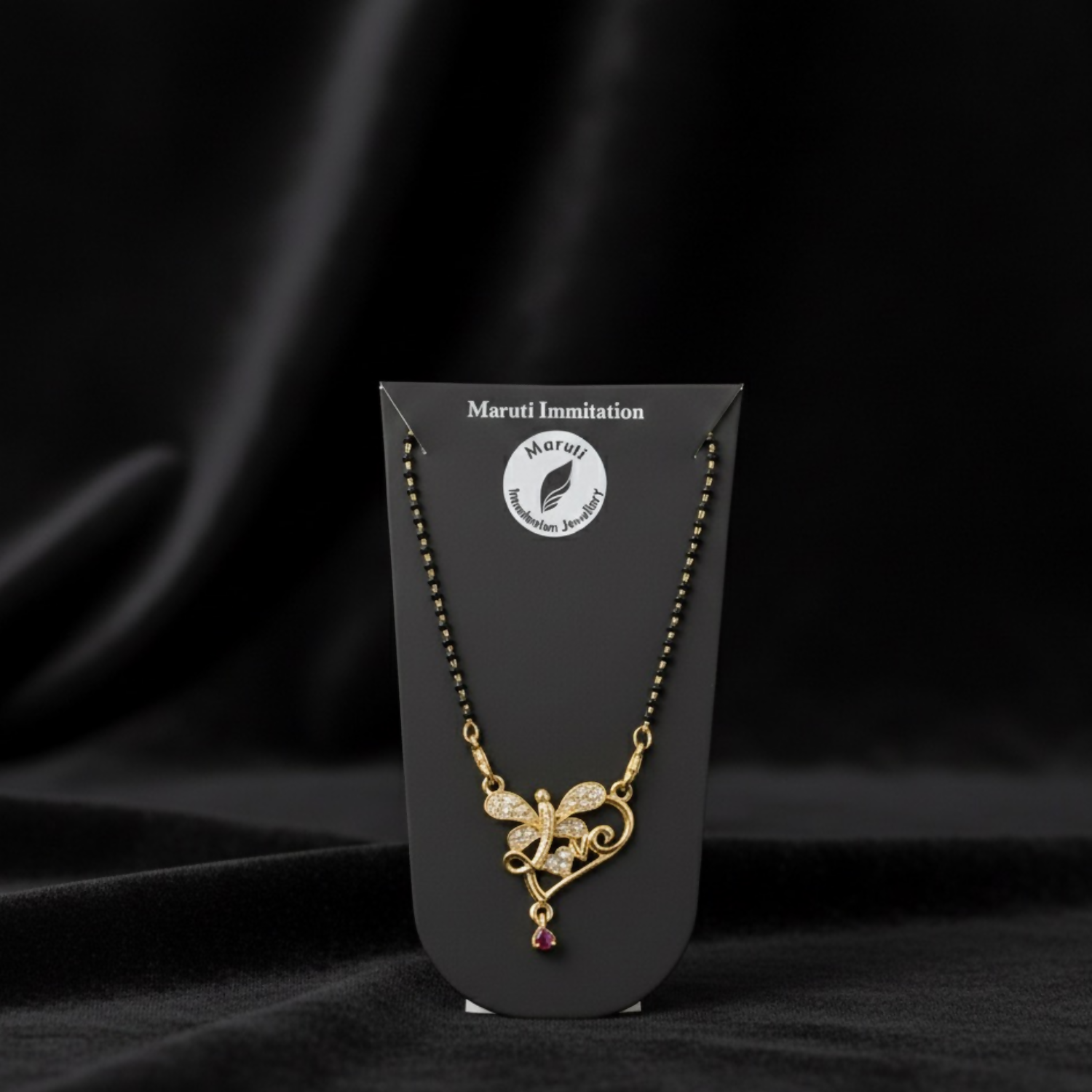 Butterfly Design Gold-Tone Mangalsutra with Sparkling Stones & Pink Dangler