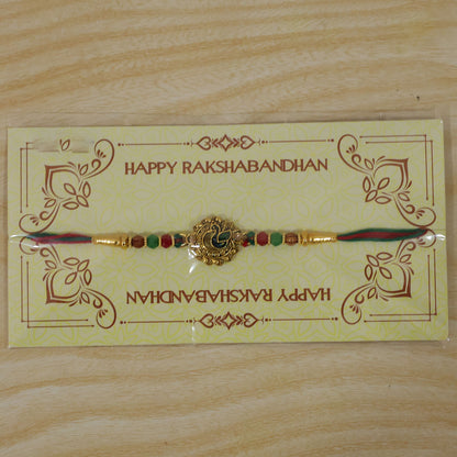 Green Peacock Enamel Rakhi with Golden Medallion, Multicolor Beads and Red Thread