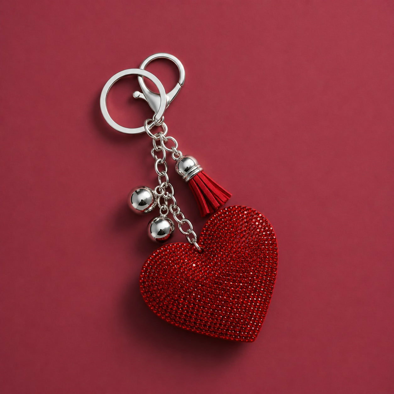 Heart crystal keychain displayed with keys and bag