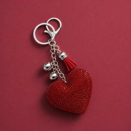 Heart crystal keychain displayed with keys and bag