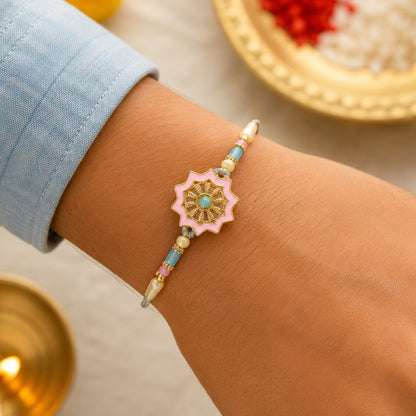 Pastel Floral Charm Rakhi with Pink Blue Beads and Elegant Festive Gift Styling Ideas