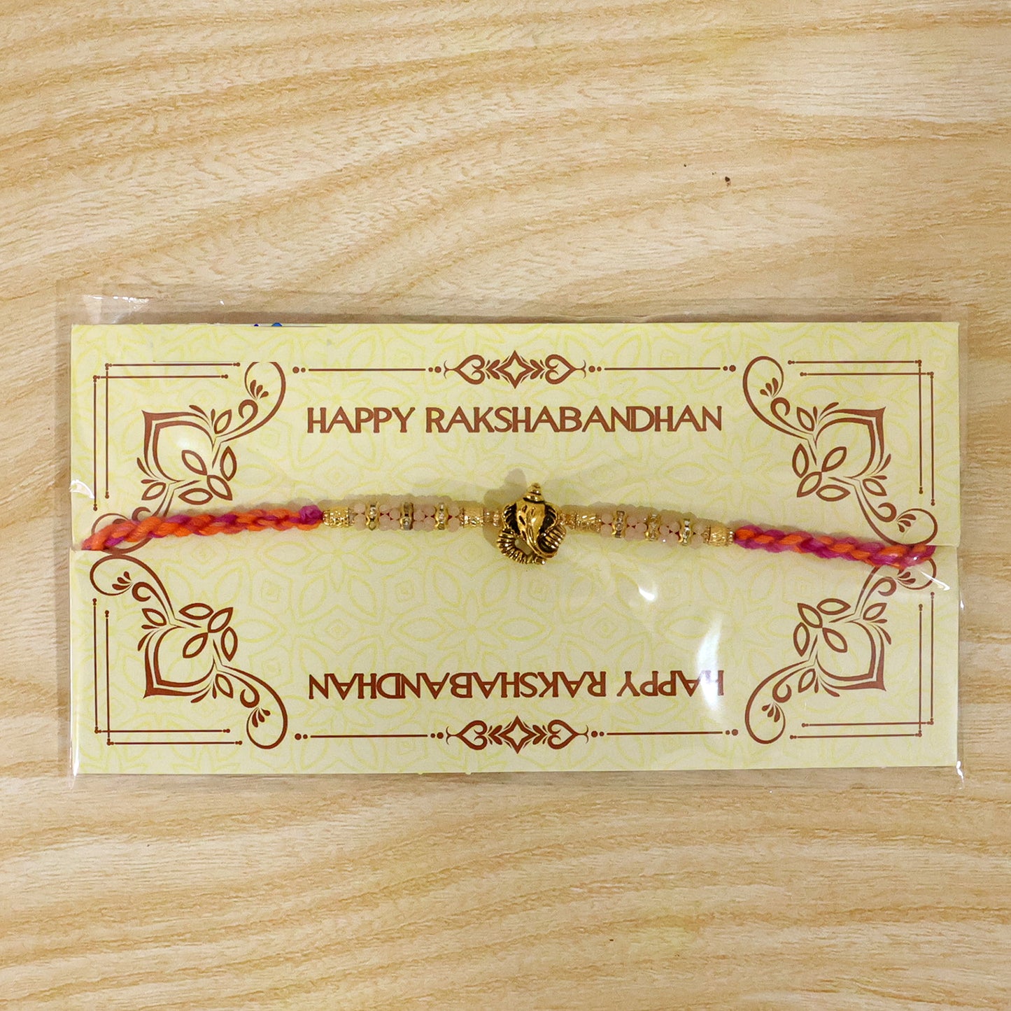 Silver Tone Designer Rakhi with Pastel Beads and Elegant Bracelet Style Finish