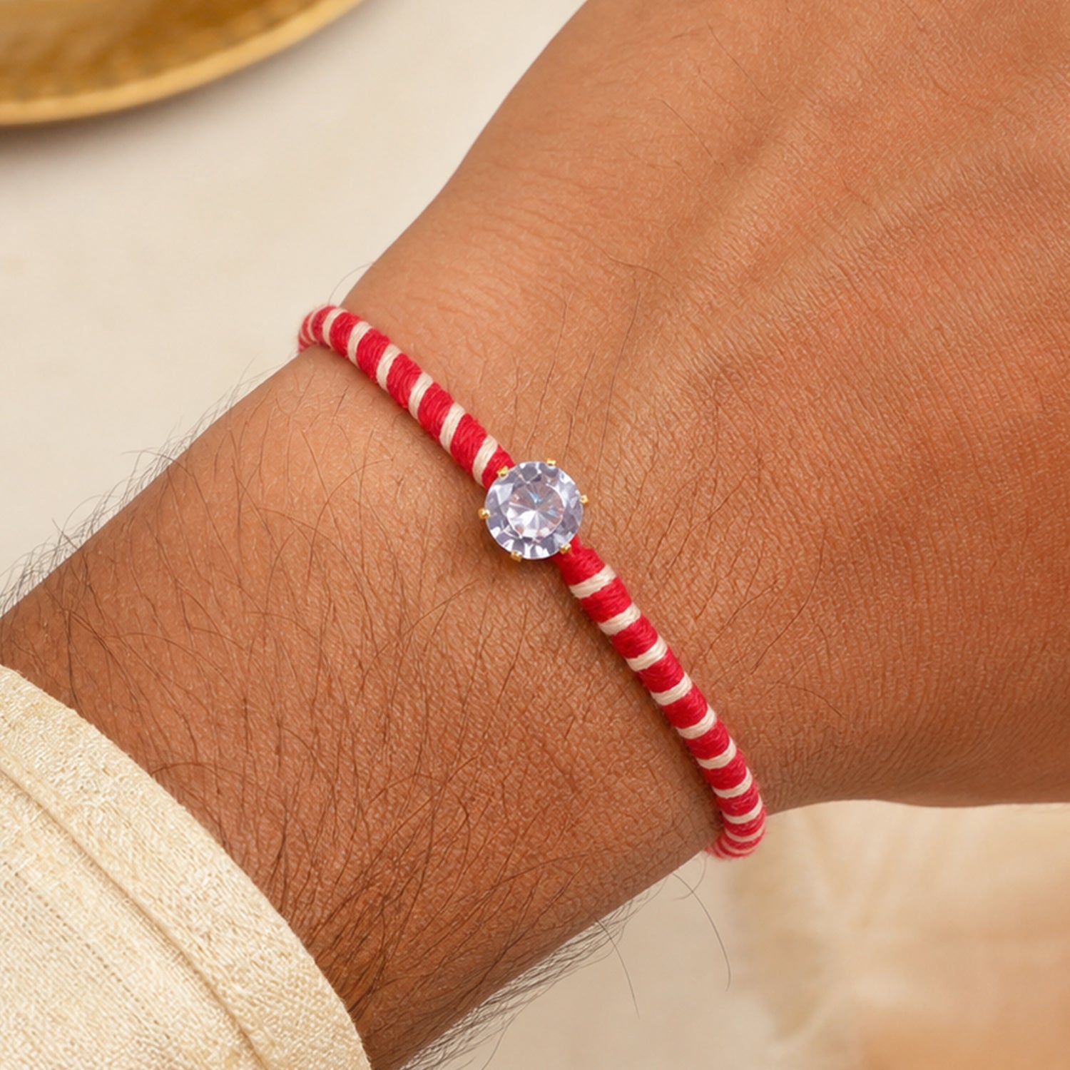 Red-White Twisted Cord Rakhi with Sparkling Round Crystal Pendant