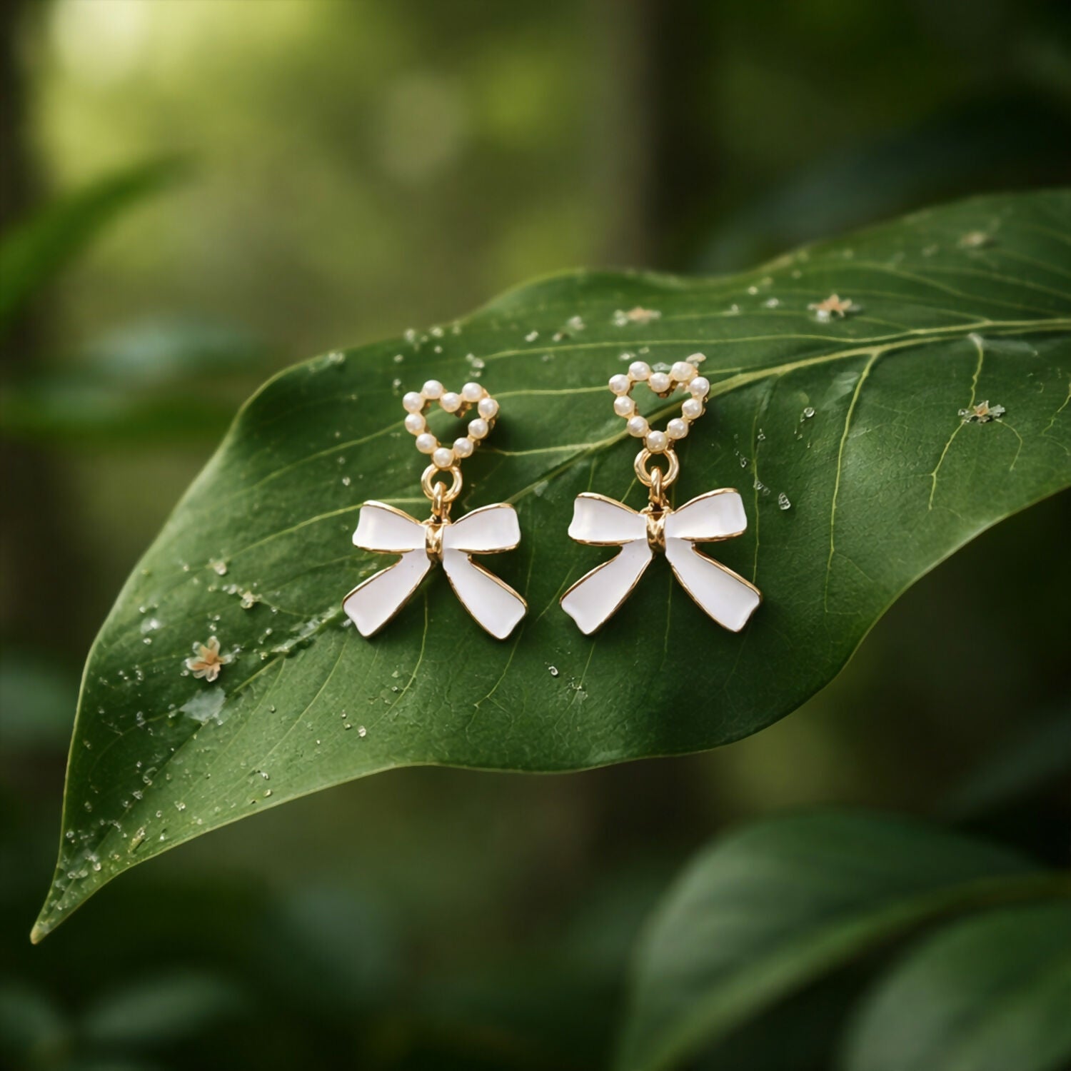 Vintage style pearl and gold earrings angled on white surface