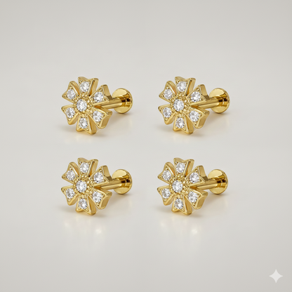Gold plated labret piercing with sunburst flower design sparkling with crystals