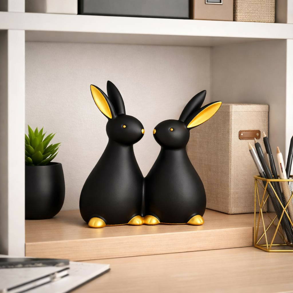 Rabbit couple showpiece with gold accents on white background
