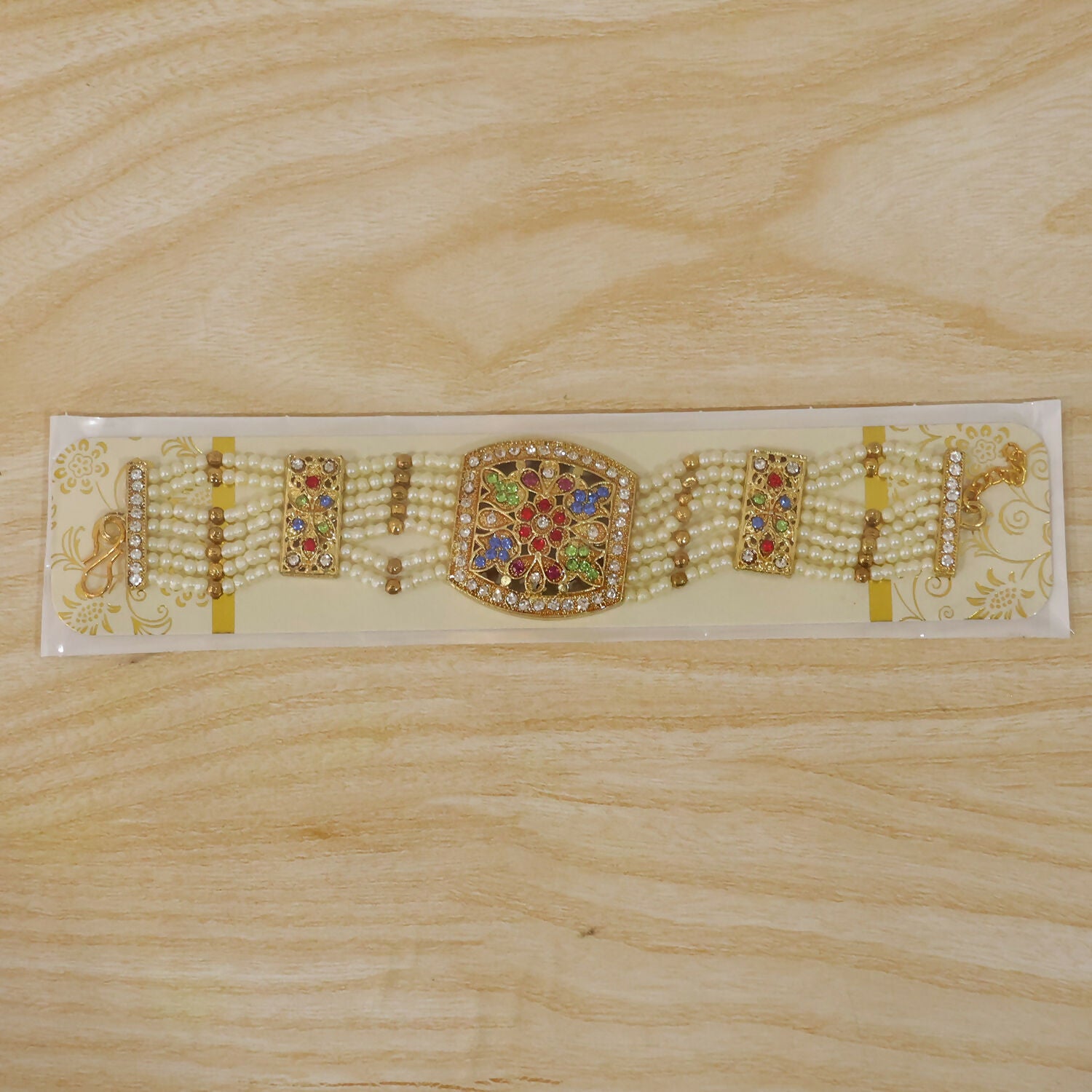 Detailed shot of pearl bracelet's multi-colored stones