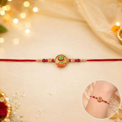Tiny Trishul Damru Rakhi with Green Stone Center and Minimal Red Thread