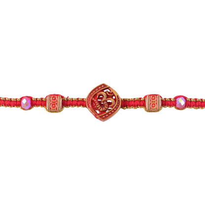 Red Swirl Stone Rakhi with Golden Detail and Beautiful Festive Centre Styling