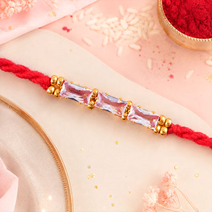 Red Thread Rakhi with a Row of Pink Baguette-Cut Crystal Beads