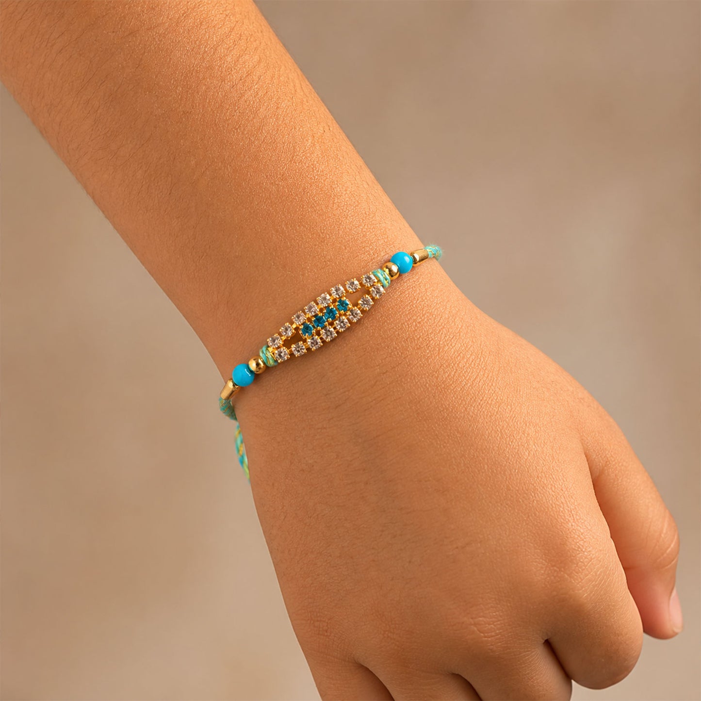 Pointed Oval Motif Rakhi with Shimmering AD Stones (Pack of 6)