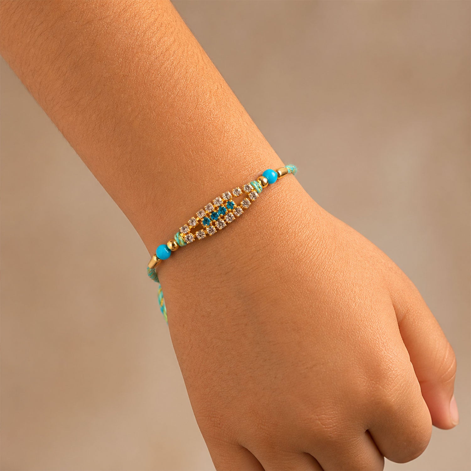 Pointed Oval Motif Rakhi with Shimmering AD Stones (Pack of 6)