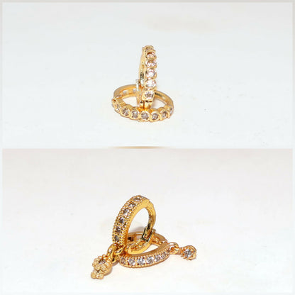 Close-up of gold plated hoop earrings with sparkling cubic zirconia stones