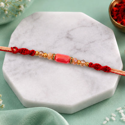 Sparkling Pearl Stone Rakhi with Colorful Thread and Premium Festive Beauty